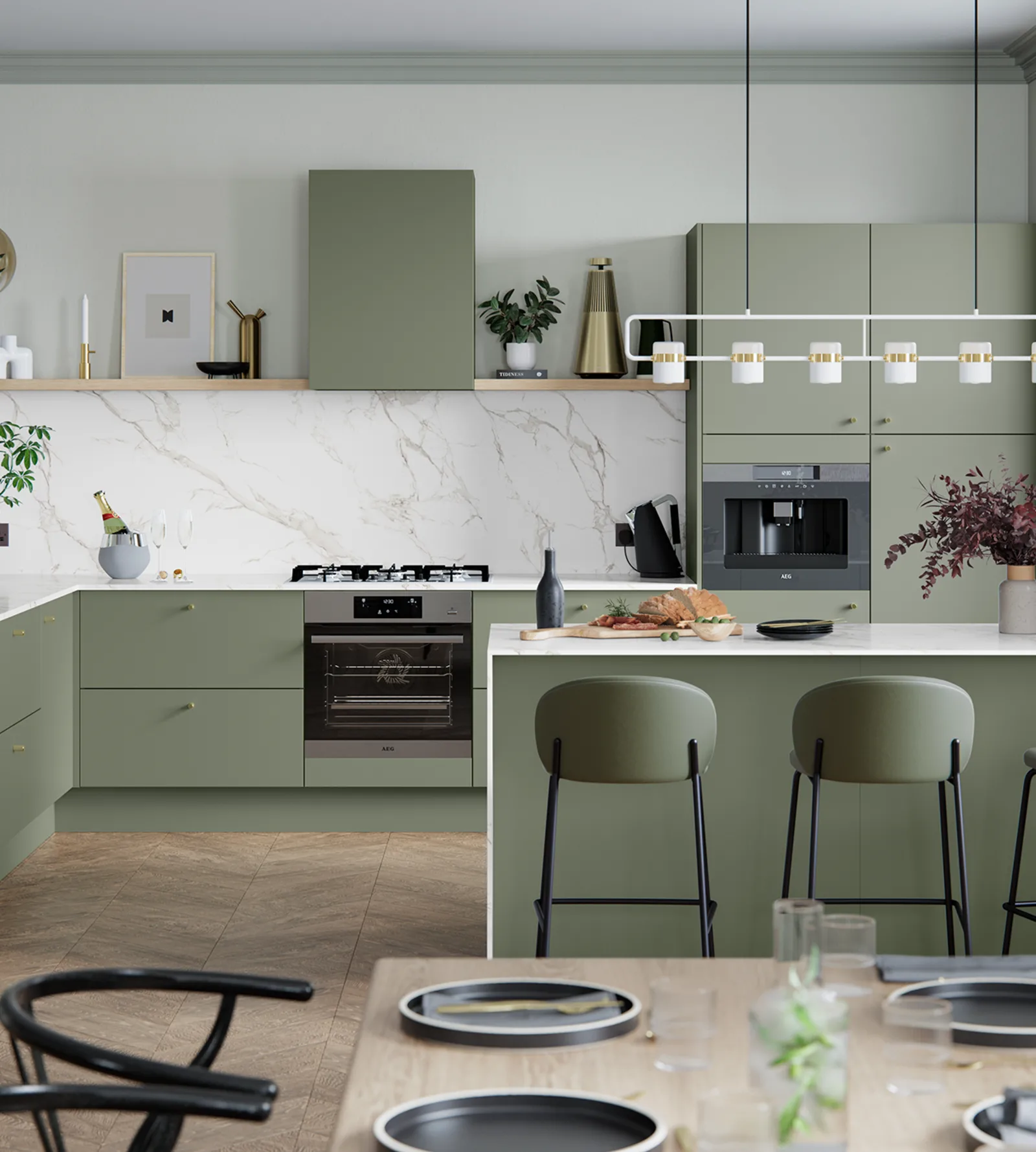 A modern kitchen featuring green cabinets and elegant white countertops, creating a fresh and inviting atmosphere.