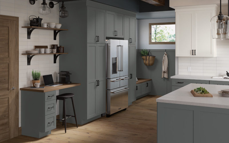 A modern kitchen featuring sleek gray cabinets paired with elegant white countertops, creating a stylish and contemporary look.