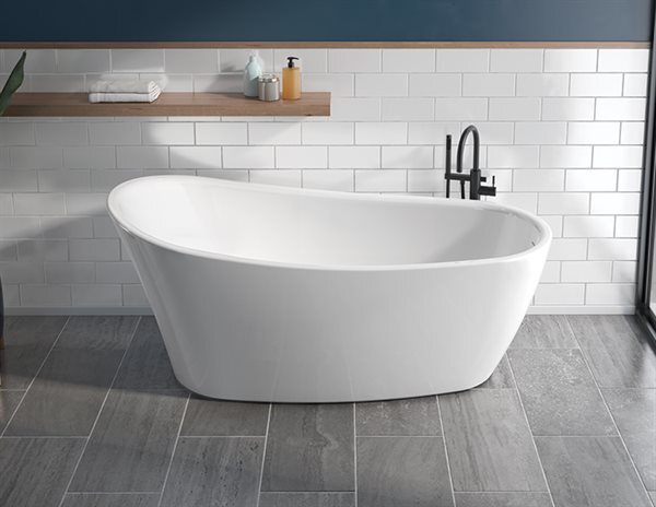 A white bathtub sits elegantly in a bathroom featuring a tile floor, creating a serene and inviting atmosphere.