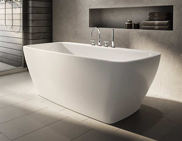 A white bathtub is showcased in a modern bathroom, with a beautiful tile floor enhancing the overall aesthetic appeal.