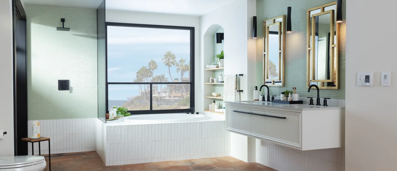 A bright bathroom featuring a large window that illuminates a spacious tub, creating a serene and inviting atmosphere.