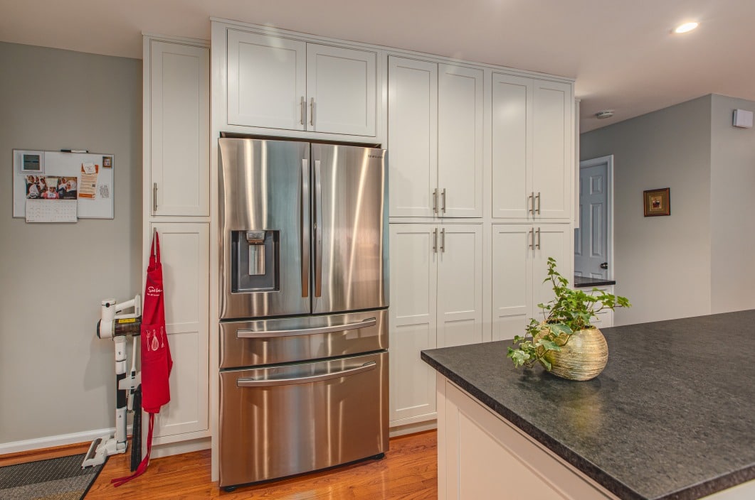 A cozy kitchen scene highlighting a dining table and a window, designed for comfort and functionality.