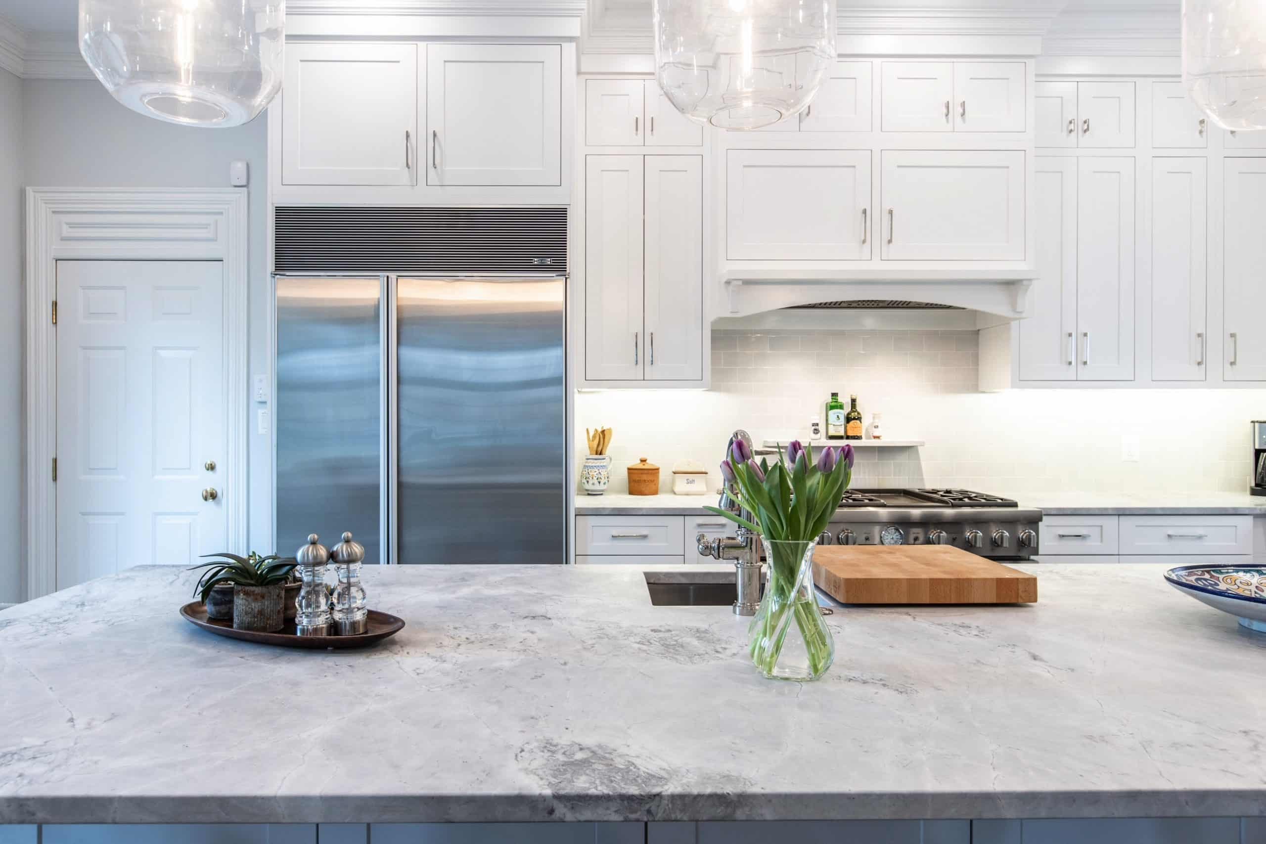 White Elegant Kitchen with luxury countertop and shaker cabinets