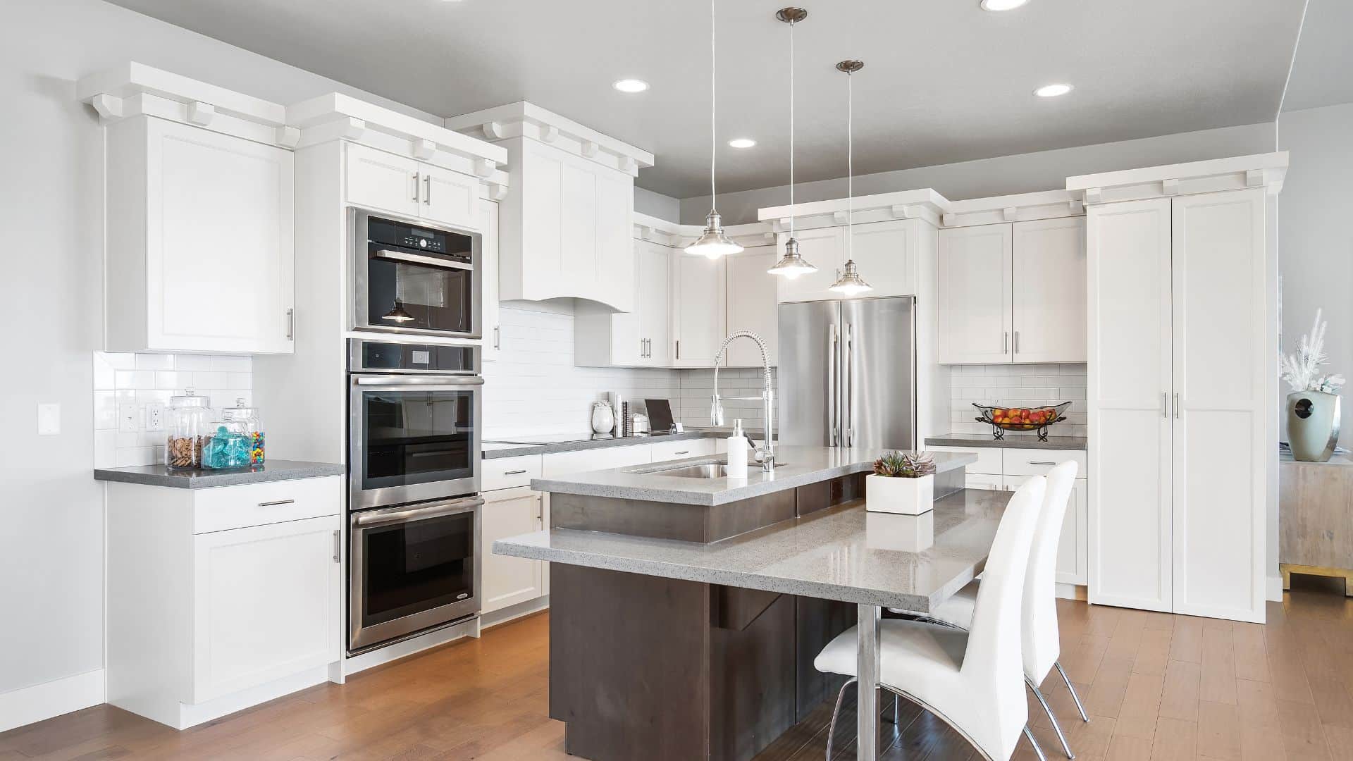 White kitchen with a center island and kitchen cabinets