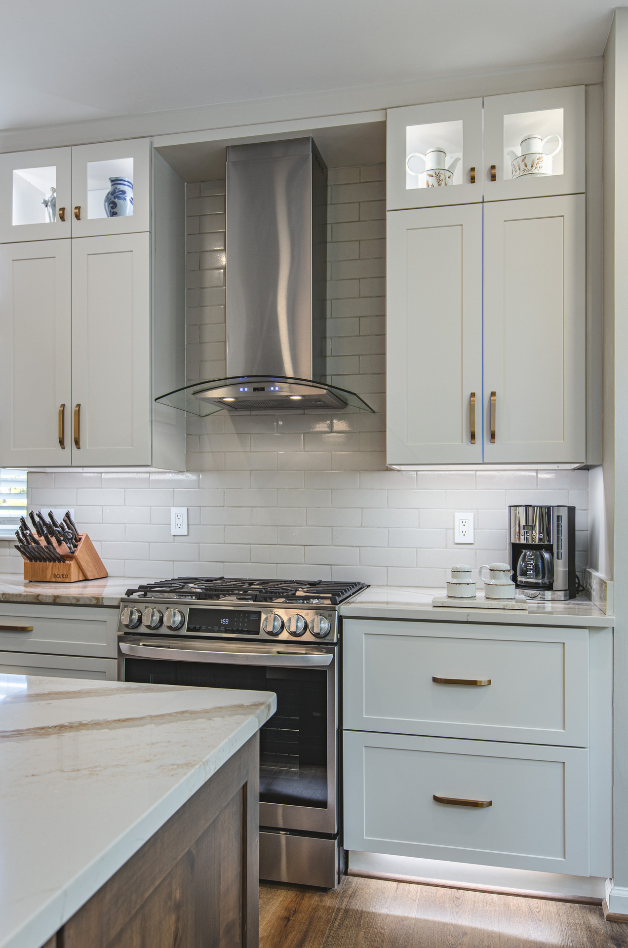 A modern kitchen featuring a stove and a microwave oven