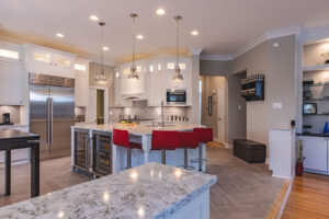 A modern kitchen with a stylish table and chairs, designed for comfort and functionality.