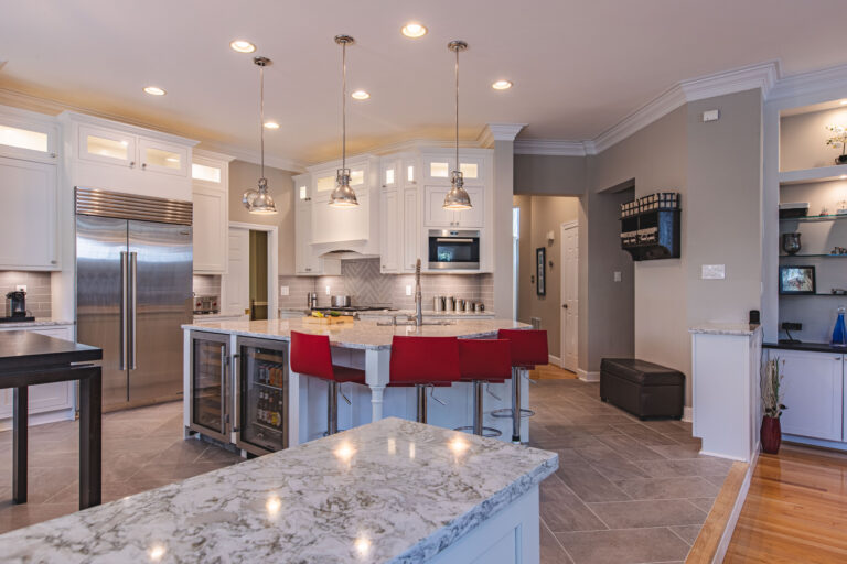 A modern kitchen with a stylish table and chairs, designed for comfort and functionality.
