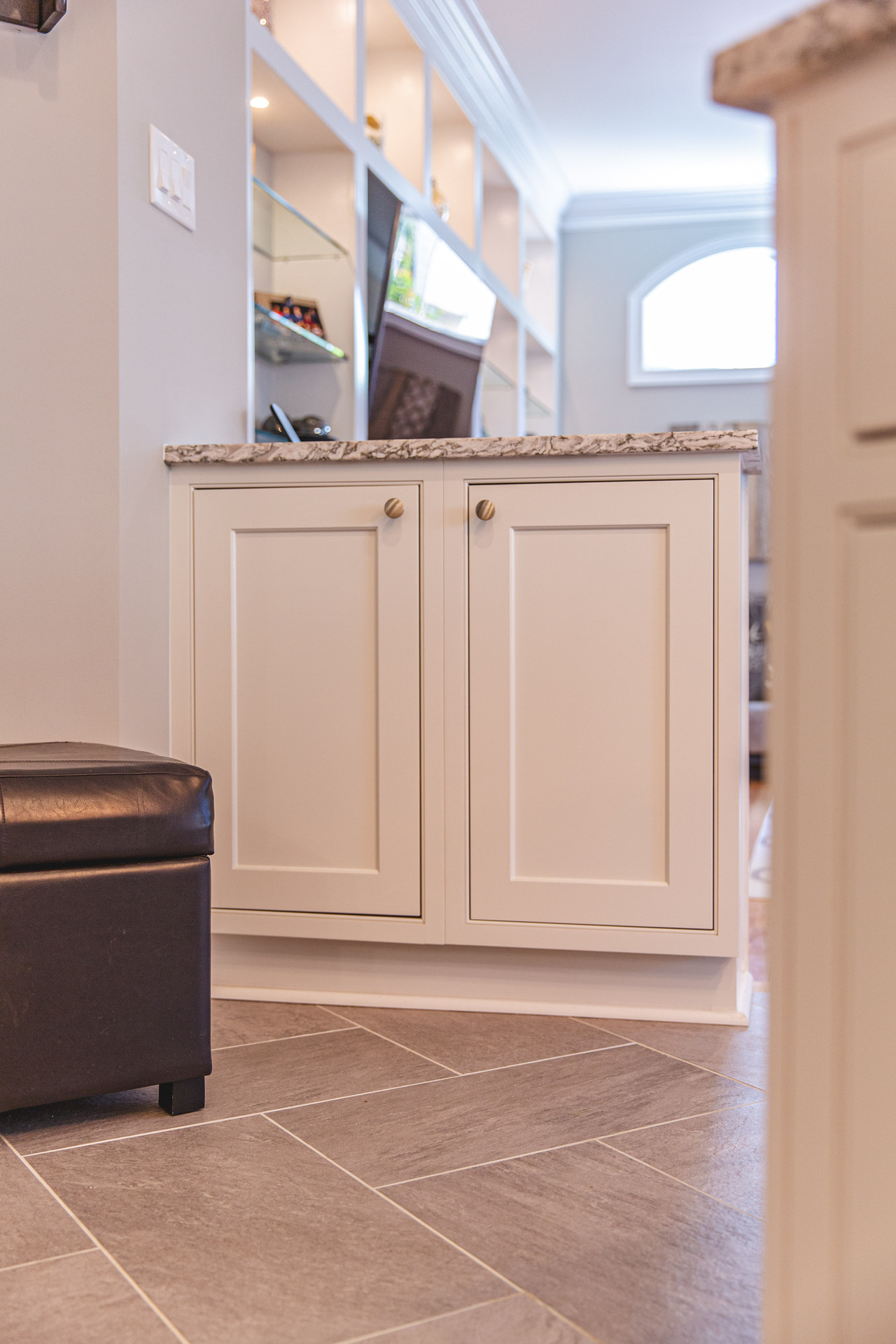 Contemporary kitchen design with pristine white cabinets and a smooth countertop, enhancing the space's overall appeal.