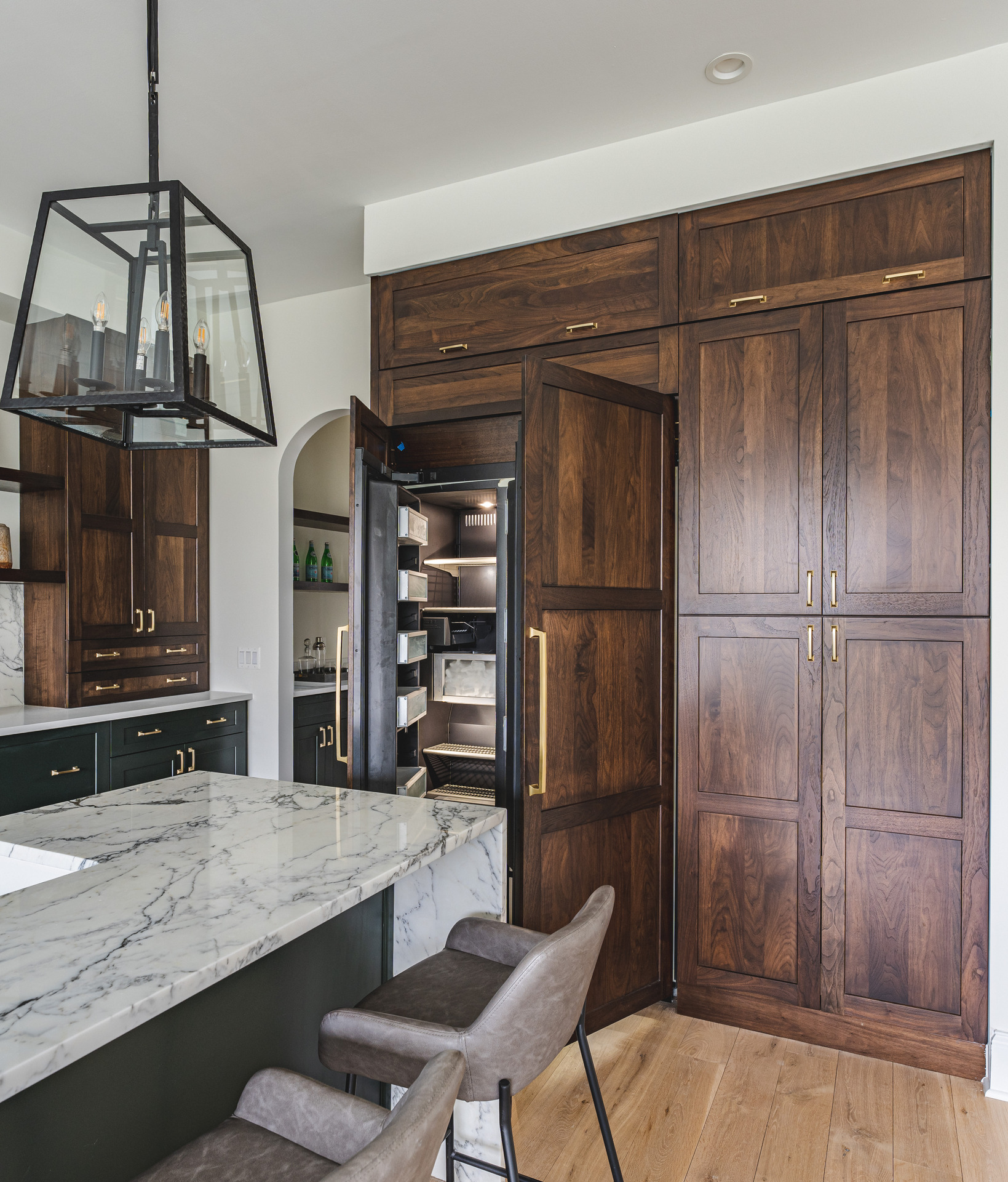 A well-organized kitchen showcasing a clean sink and a polished countertop