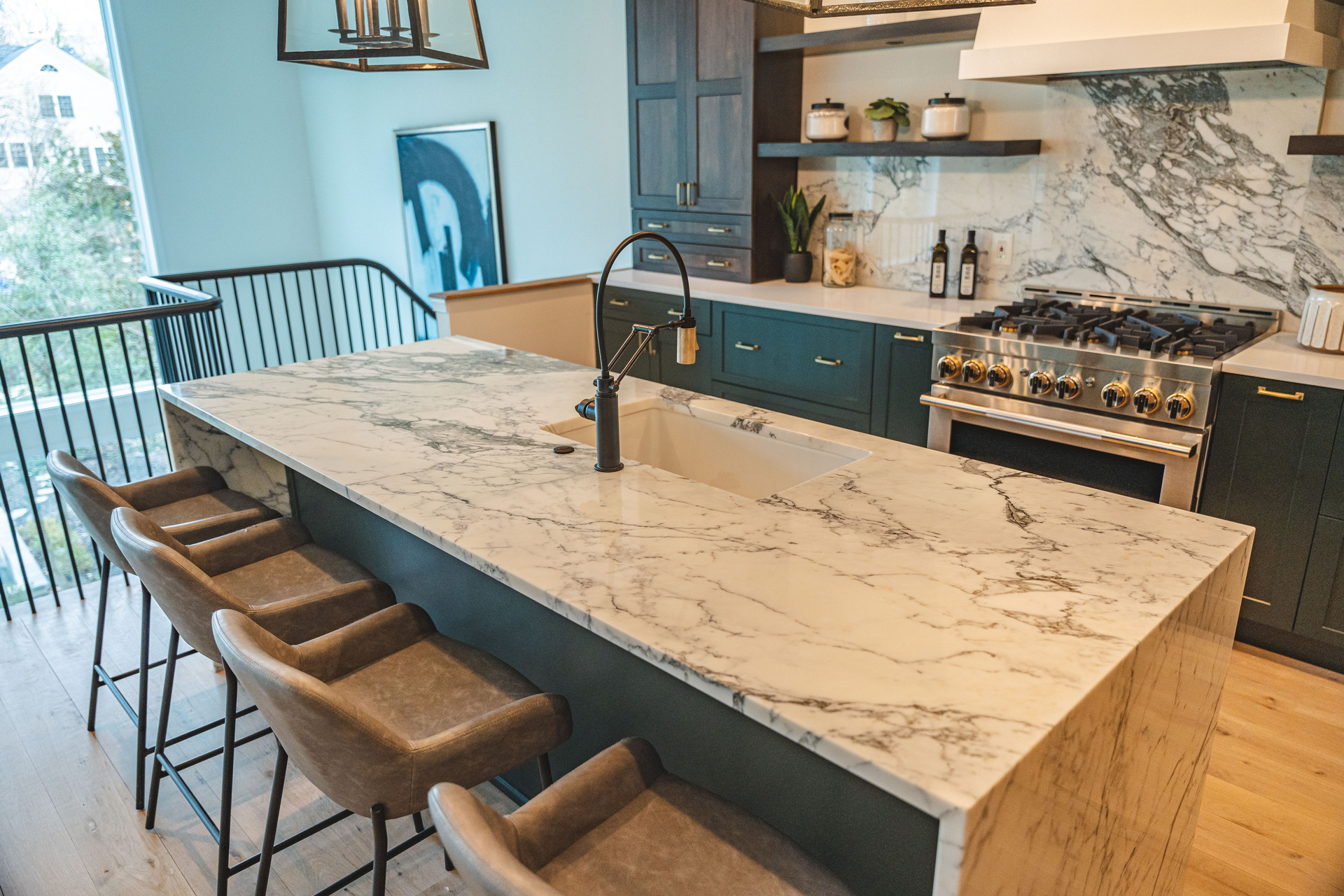 A stylish kitchen that includes a dining table and chairs