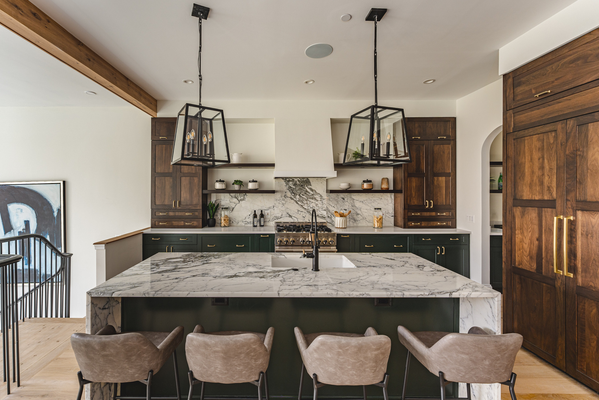 A modern kitchen featuring elegant marble countertops paired with warm wooden cabinets, creating a stylish and inviting atmosphere