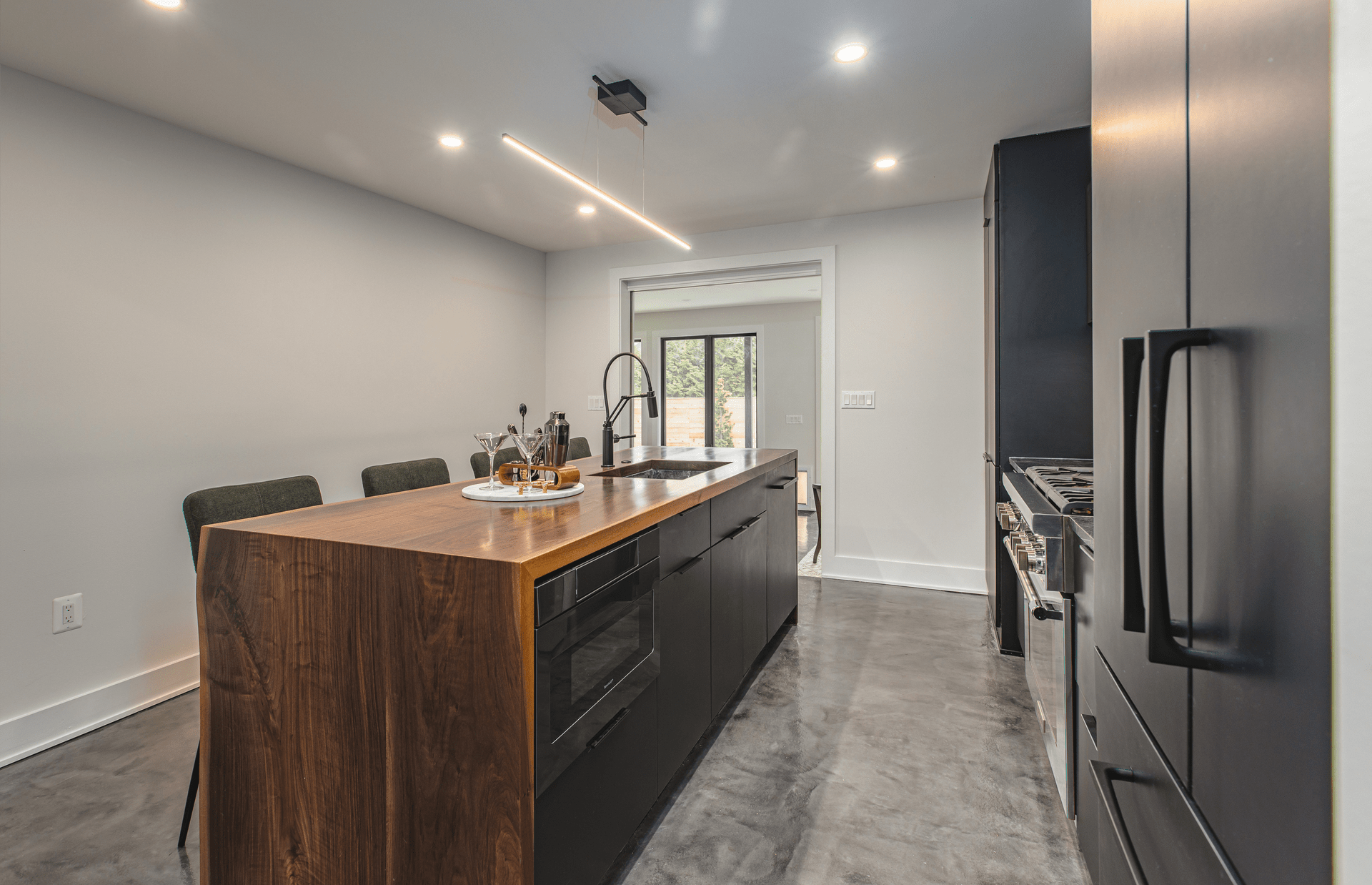 A well-designed kitchen with a polished counter and a functional sink, emphasizing a contemporary aesthetic.